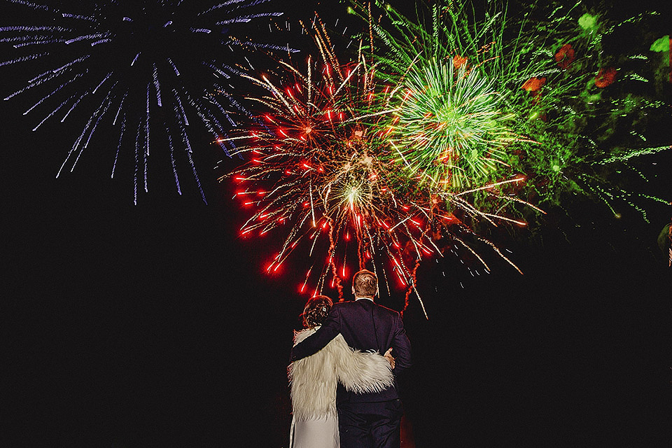 Bride Olivia wore a Charlie Brear gown for her Papakata teepee wedding on New Years Eve. The coupled tied the knot in the bride's mothers garden. Photography by Steve Rooney.