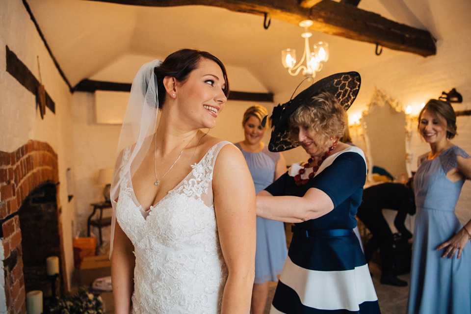 A rainy day, Spring barn wedding at Lillibrooke Manor. The bride wore Mori Lee. Photography by Ed Godden.