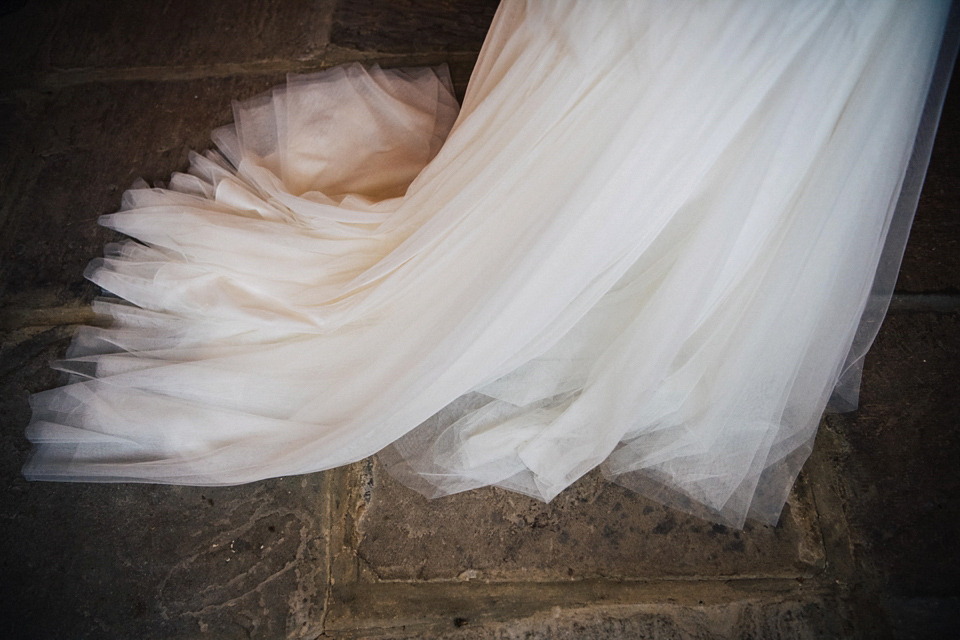 A rainy day, Spring barn wedding at Lillibrooke Manor. The bride wore Mori Lee. Photography by Ed Godden.