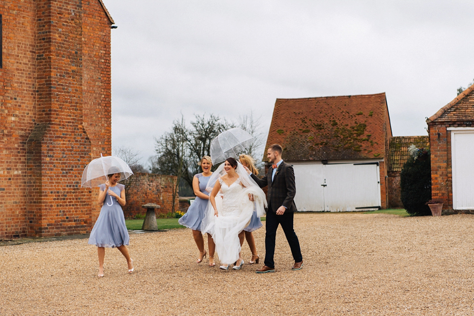 A rainy day, Spring barn wedding at Lillibrooke Manor. The bride wore Mori Lee. Photography by Ed Godden.