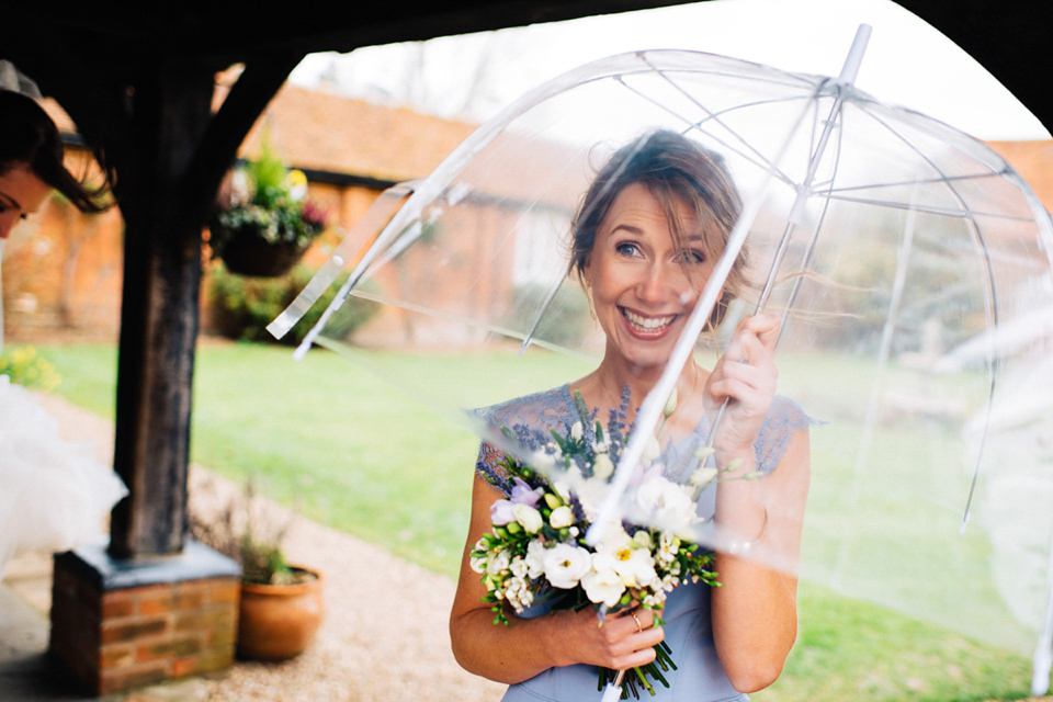 A rainy day, Spring barn wedding at Lillibrooke Manor. The bride wore Mori Lee. Photography by Ed Godden.