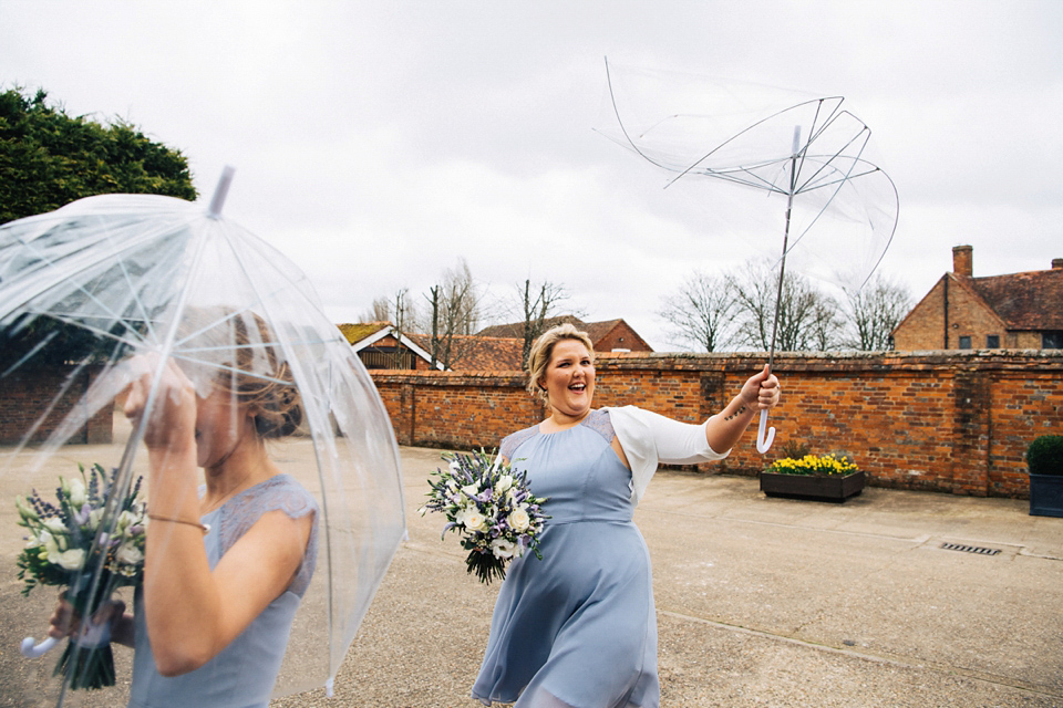 A rainy day, Spring barn wedding at Lillibrooke Manor. The bride wore Mori Lee. Photography by Ed Godden.