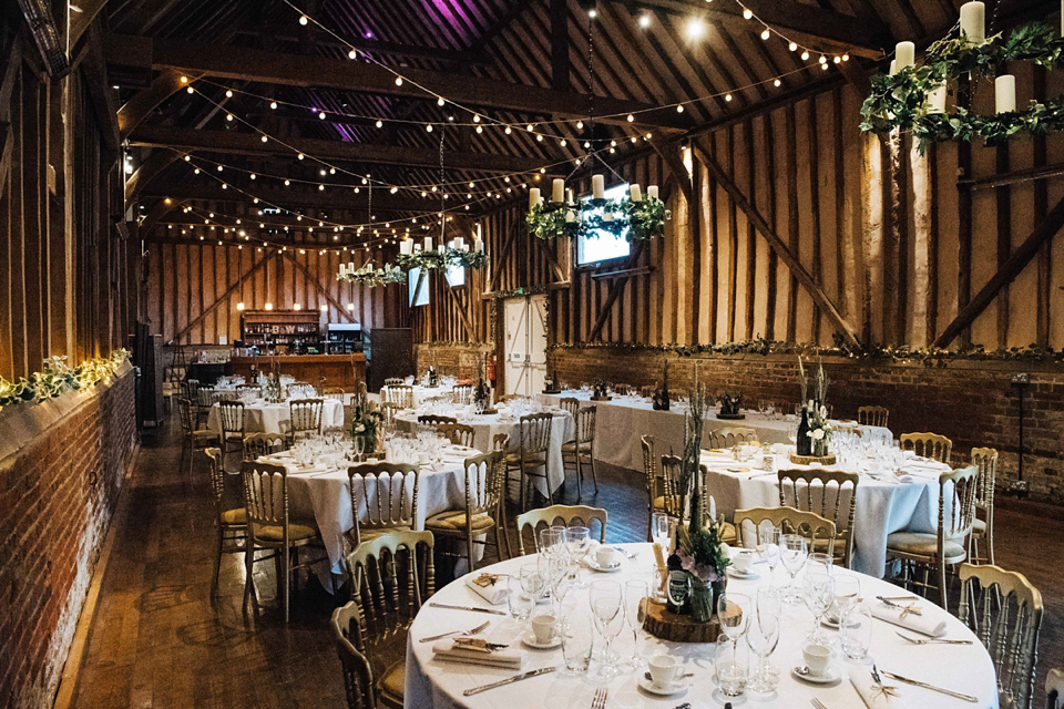 A rainy day, Spring barn wedding at Lillibrooke Manor. The bride wore Mori Lee. Photography by Ed Godden.