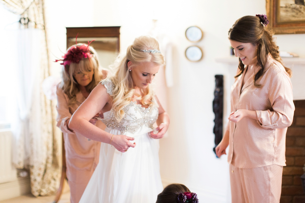 The bride wears Anna Campbell for her winter wedding at Dewsall Court. Fine Art wedding photography by Melissa Beattie.