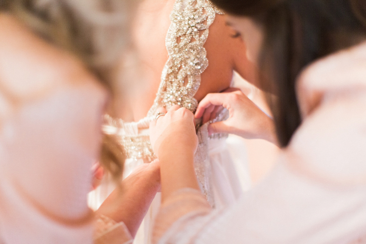 The bride wears Anna Campbell for her winter wedding at Dewsall Court. Fine Art wedding photography by Melissa Beattie.