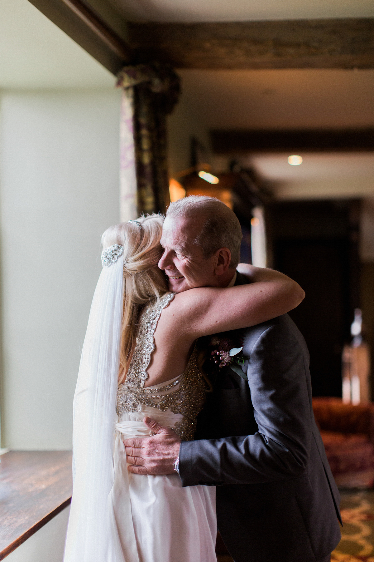 The bride wears Anna Campbell for her winter wedding at Dewsall Court. Fine Art wedding photography by Melissa Beattie.