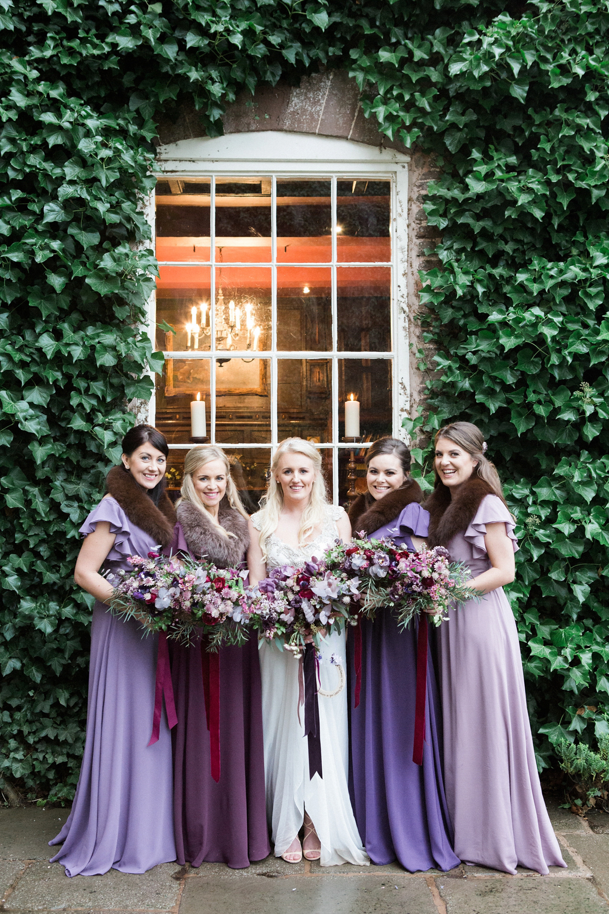 The bride wears Anna Campbell for her winter wedding at Dewsall Court. Fine Art wedding photography by Melissa Beattie.