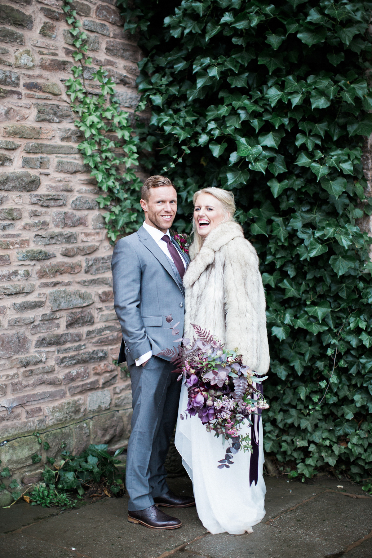 The bride wears Anna Campbell for her winter wedding at Dewsall Court. Fine Art wedding photography by Melissa Beattie.