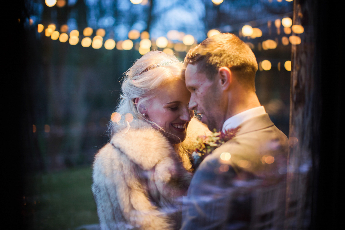 The bride wears Anna Campbell for her winter wedding at Dewsall Court. Fine Art wedding photography by Melissa Beattie.