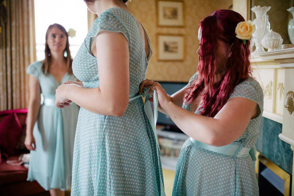 Sarah wears a 1950's inspired dress for her rustic wedding at Danby Castle in North Yorkshire. Photography by Stott & Atkinson.