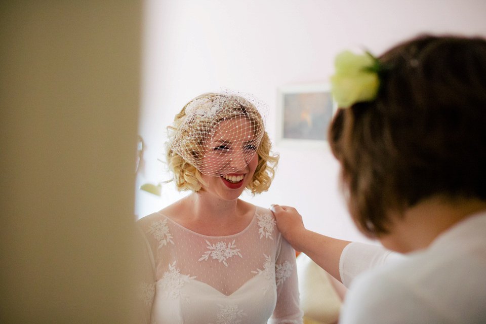 Sarah wears a 1950's inspired dress for her rustic wedding at Danby Castle in North Yorkshire. Photography by Stott & Atkinson.