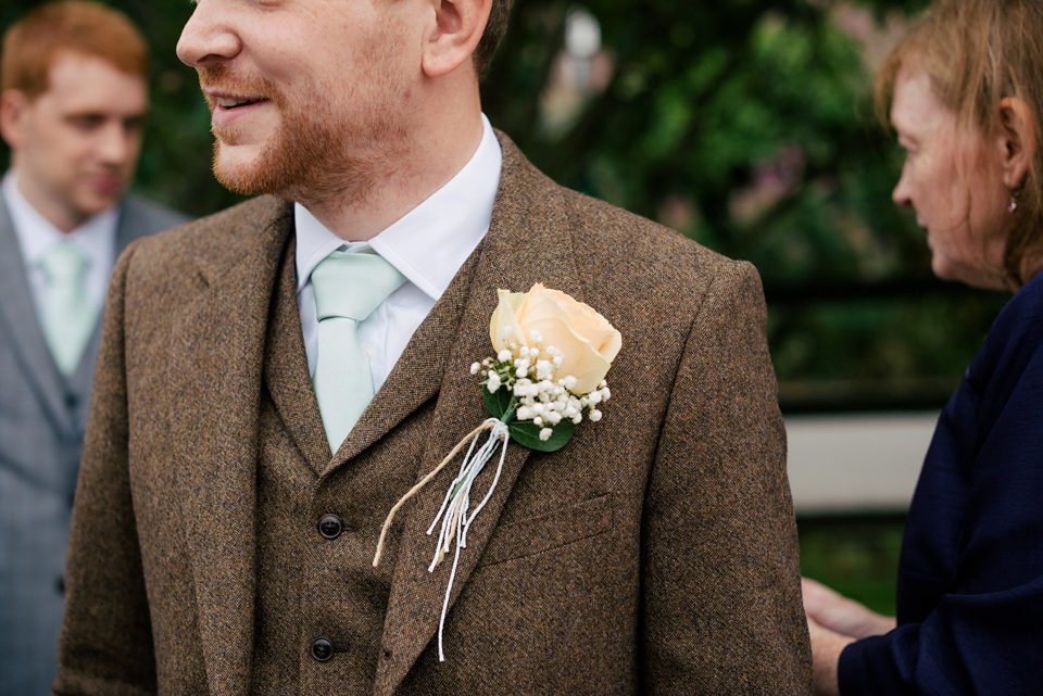 Sarah wears a 1950's inspired dress for her rustic wedding at Danby Castle in North Yorkshire. Photography by Stott & Atkinson.