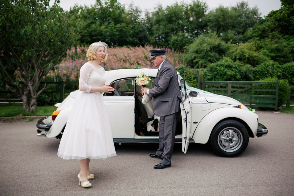 Sarah wears a 1950's inspired dress for her rustic wedding at Danby Castle in North Yorkshire. Photography by Stott & Atkinson.