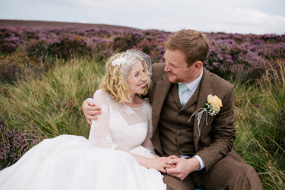 Sarah wears a 1950's inspired dress for her rustic wedding at Danby Castle in North Yorkshire. Photography by Stott & Atkinson.