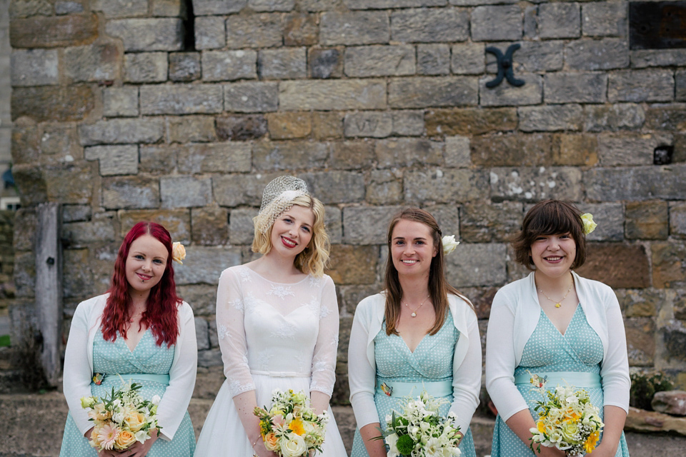 Sarah wears a 1950's inspired dress for her rustic wedding at Danby Castle in North Yorkshire. Photography by Stott & Atkinson.