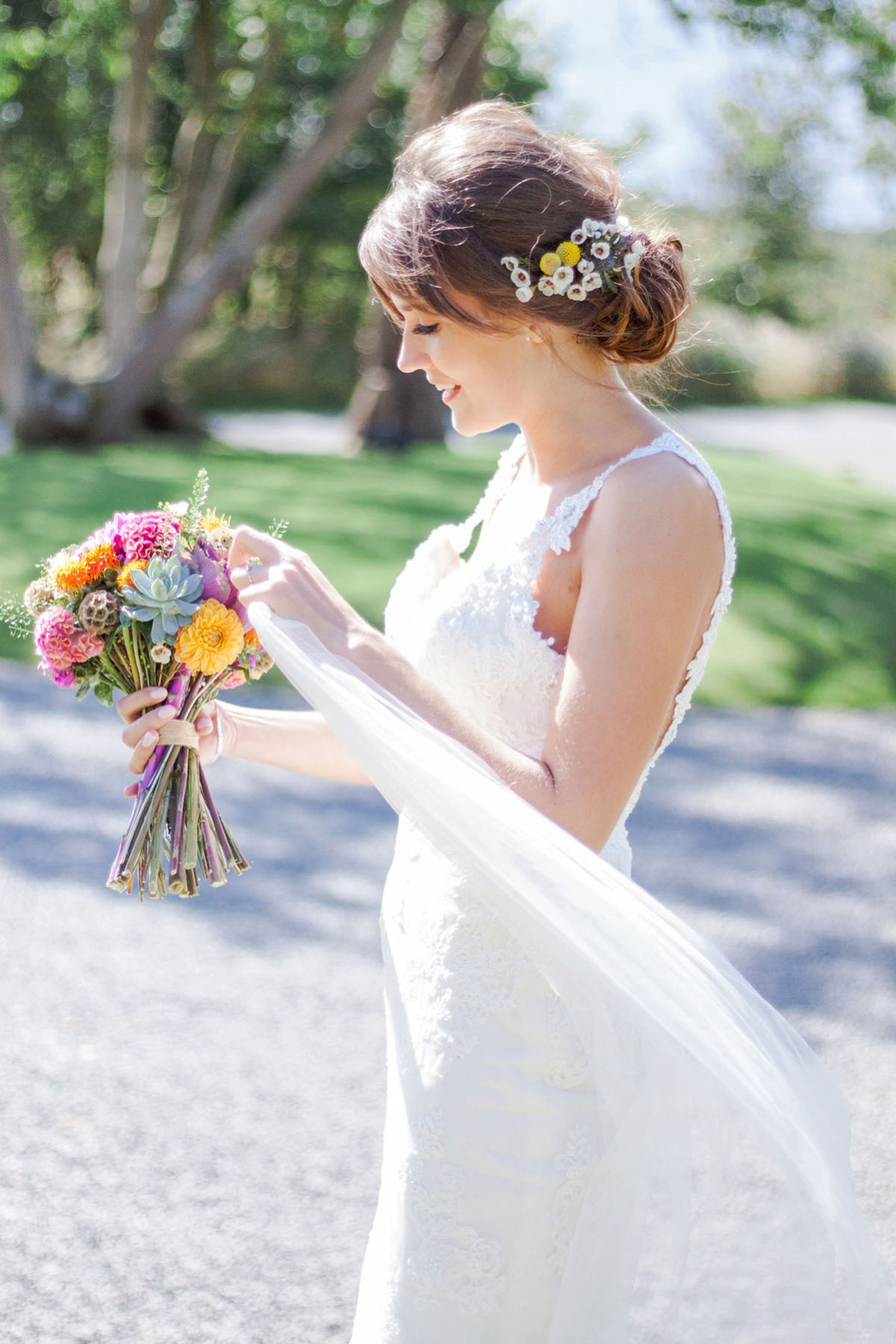 Abigail wore a backless Pronovias gown for her colourful Summer wedding at Shustoke Barn. Photogrpahy by Ria Beth.