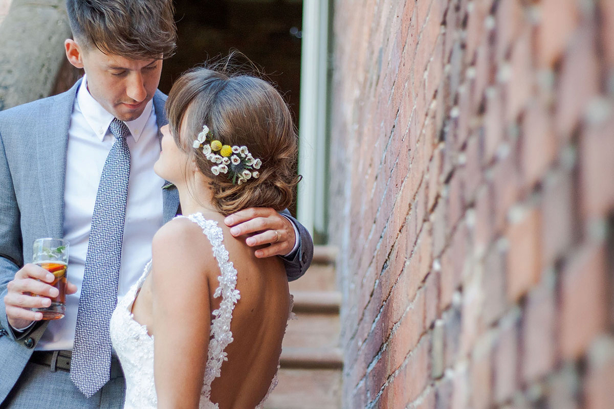 Abigail wore a backless Pronovias gown for her colourful Summer wedding at Shustoke Barn. Photogrpahy by Ria Beth.