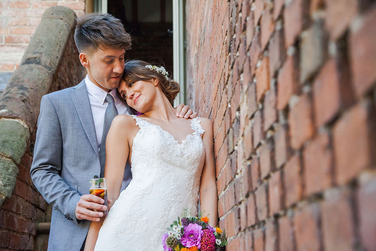 Abigail wore a backless Pronovias gown for her colourful Summer wedding at Shustoke Barn. Photogrpahy by Ria Beth.