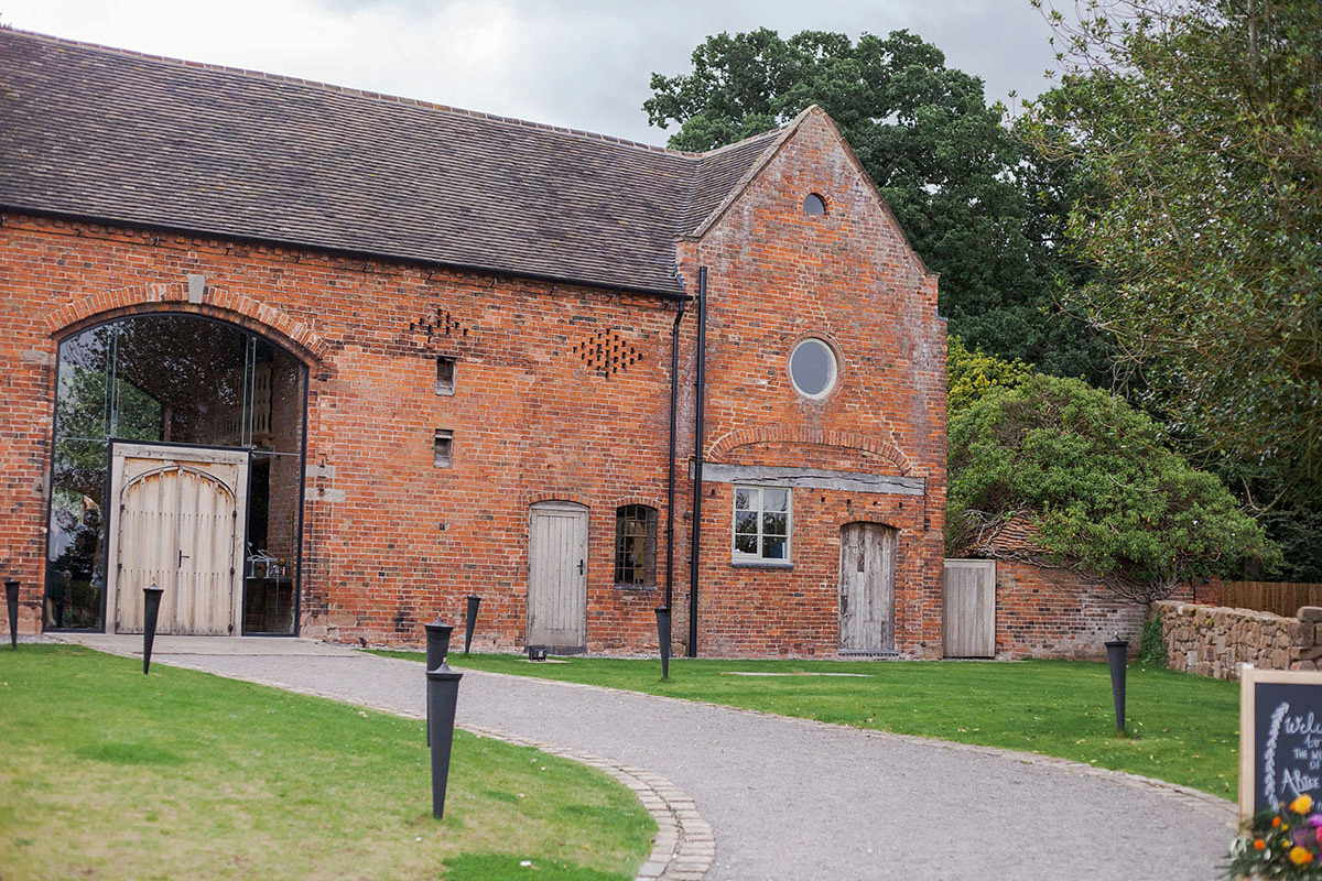 Abigail wore a backless Pronovias gown for her colourful Summer wedding at Shustoke Barn. Photogrpahy by Ria Beth.