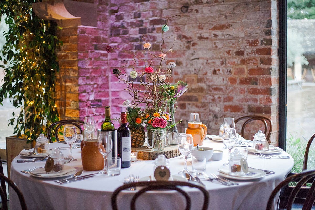 Abigail wore a backless Pronovias gown for her colourful Summer wedding at Shustoke Barn. Photogrpahy by Ria Beth.