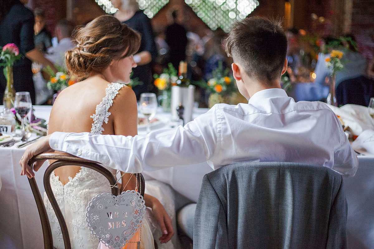 Abigail wore a backless Pronovias gown for her colourful Summer wedding at Shustoke Barn. Photogrpahy by Ria Beth.