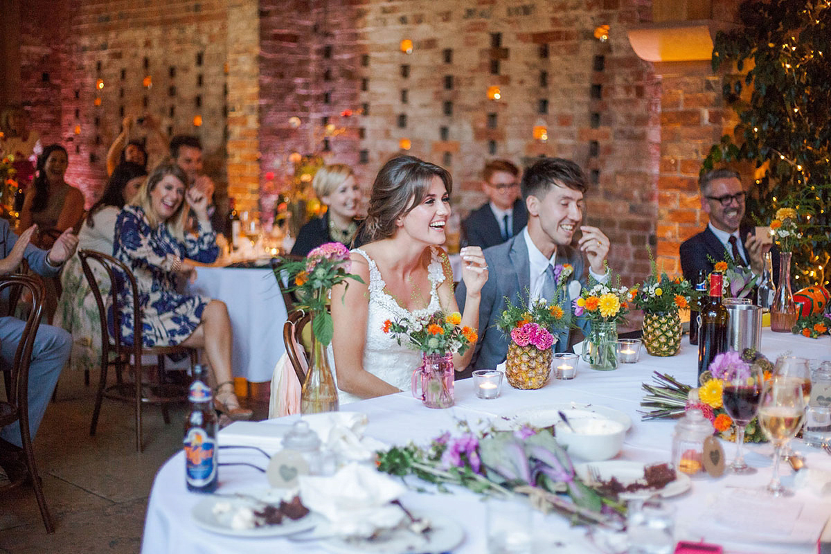 Abigail wore a backless Pronovias gown for her colourful Summer wedding at Shustoke Barn. Photogrpahy by Ria Beth.