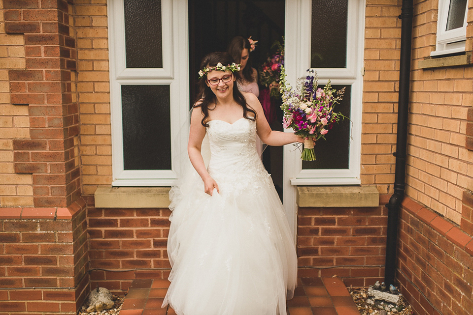 A beautiful bride wearing glasses and an Alfred Angelo gown for her Christian wedding. Photography by Matt Penberthy.