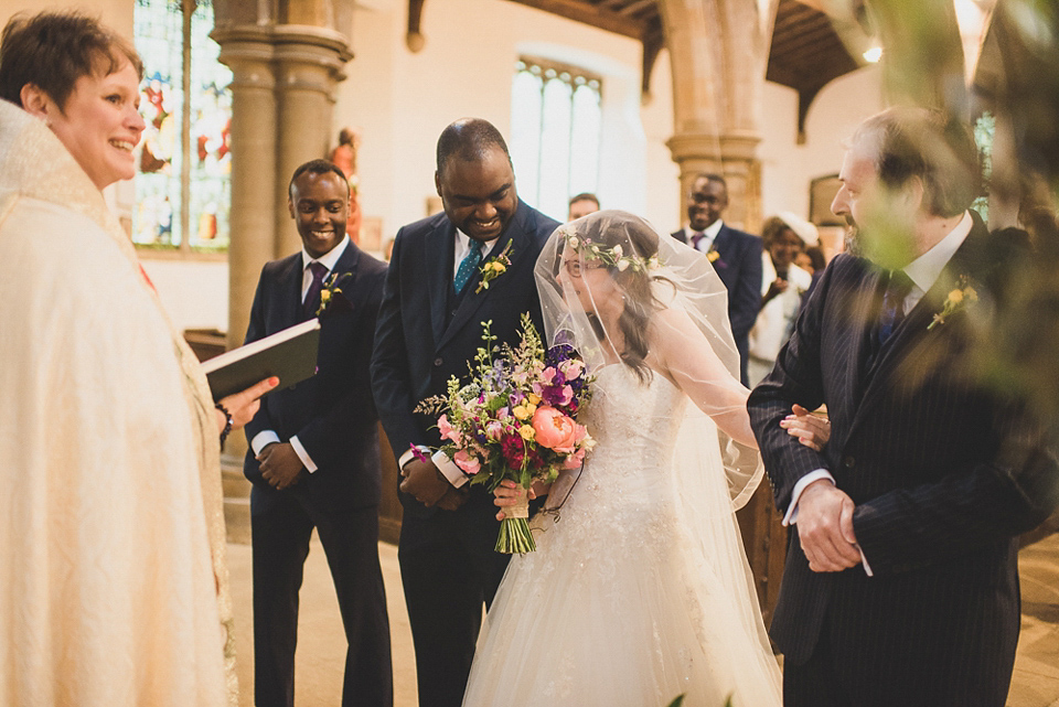 A beautiful bride wearing glasses and an Alfred Angelo gown for her Christian wedding. Photography by Matt Penberthy.