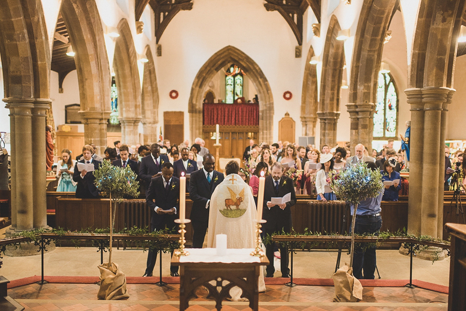 A beautiful bride wearing glasses and an Alfred Angelo gown for her Christian wedding. Photography by Matt Penberthy.