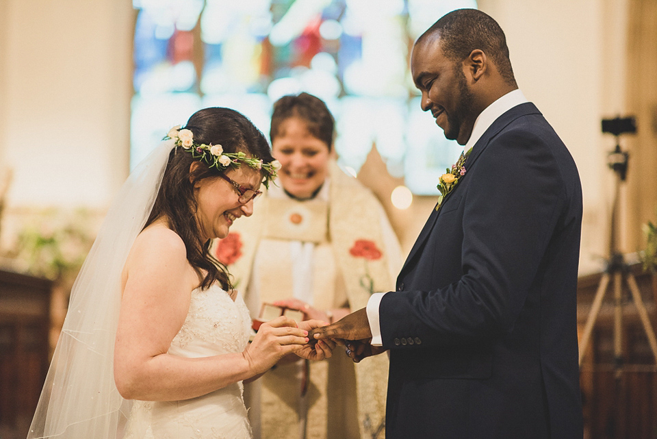 A beautiful bride wearing glasses and an Alfred Angelo gown for her Christian wedding. Photography by Matt Penberthy.