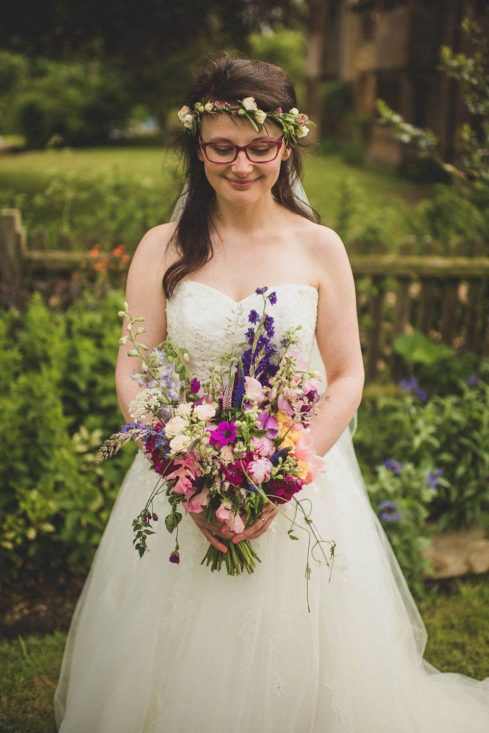 A beautiful bride wearing glasses and an Alfred Angelo gown for her Christian wedding. Photography by Matt Penberthy.