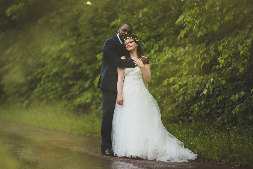 A beautiful bride wearing glasses and an Alfred Angelo gown for her Christian wedding. Photography by Matt Penberthy.