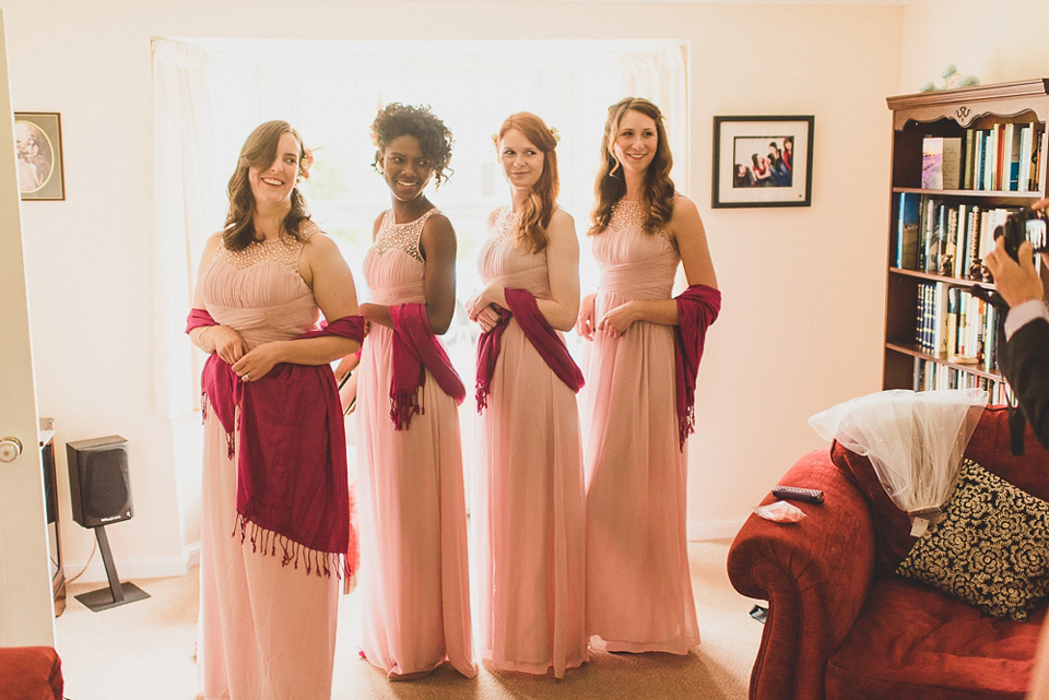 A beautiful bride wearing glasses and an Alfred Angelo gown for her Christian wedding. Photography by Matt Penberthy.