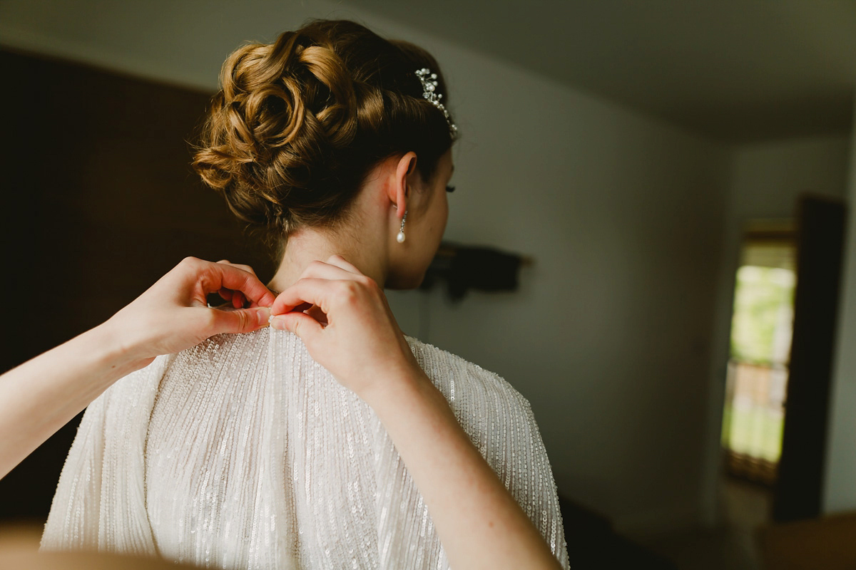 Alice wears a Downton Abbey inspired beaded gown by Eliza Jane Howell for her Suffolk countryside wedding. Photography by Andy Davison.