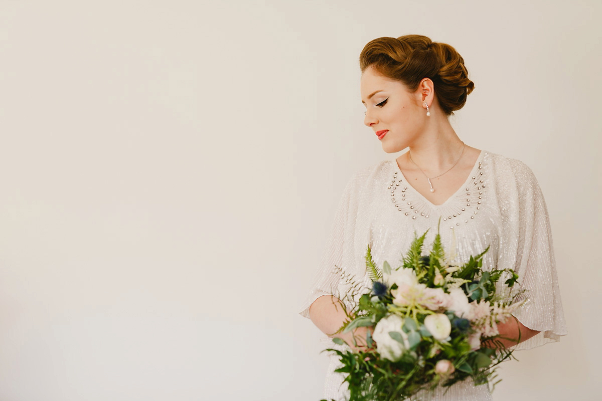 Alice wears a Downton Abbey inspired beaded gown by Eliza Jane Howell for her Suffolk countryside wedding. Photography by Andy Davison.