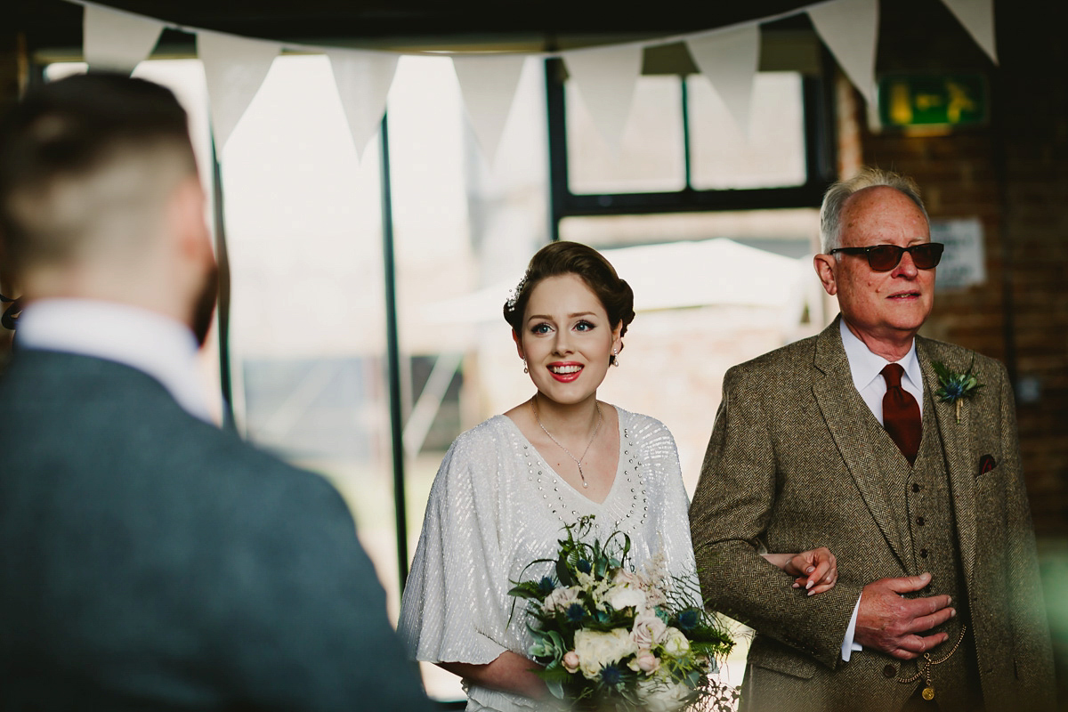 Alice wears a Downton Abbey inspired beaded gown by Eliza Jane Howell for her Suffolk countryside wedding. Photography by Andy Davison.