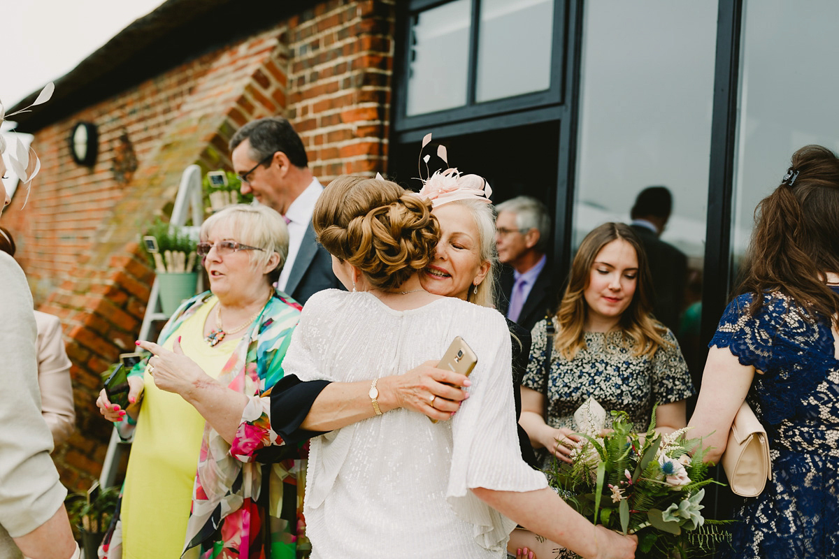 Alice wears a Downton Abbey inspired beaded gown by Eliza Jane Howell for her Suffolk countryside wedding. Photography by Andy Davison.