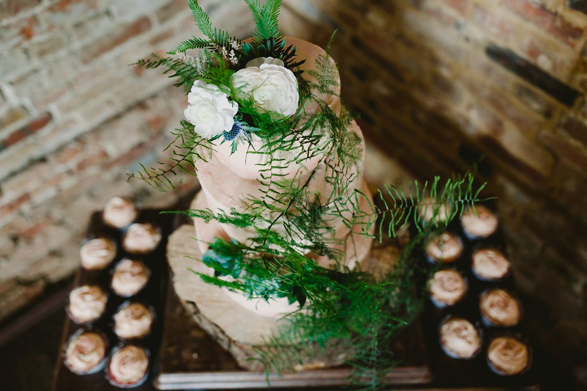 Alice wears a Downton Abbey inspired beaded gown by Eliza Jane Howell for her Suffolk countryside wedding. Photography by Andy Davison.