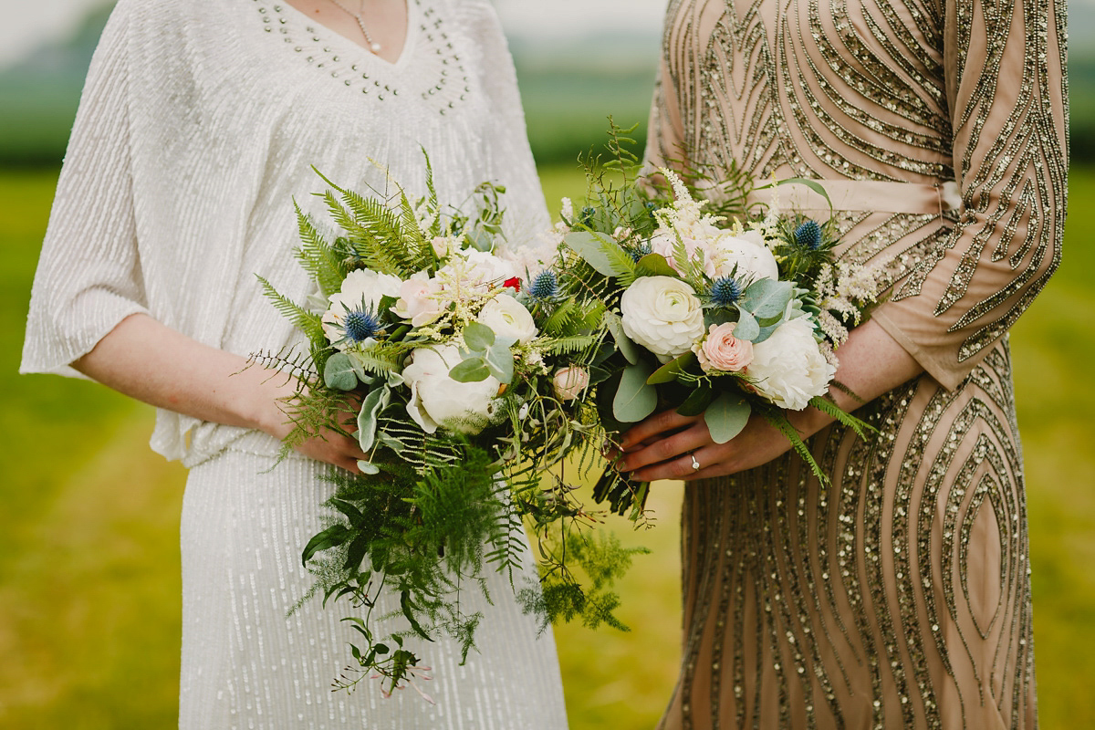 Alice wears a Downton Abbey inspired beaded gown by Eliza Jane Howell for her Suffolk countryside wedding. Photography by Andy Davison.