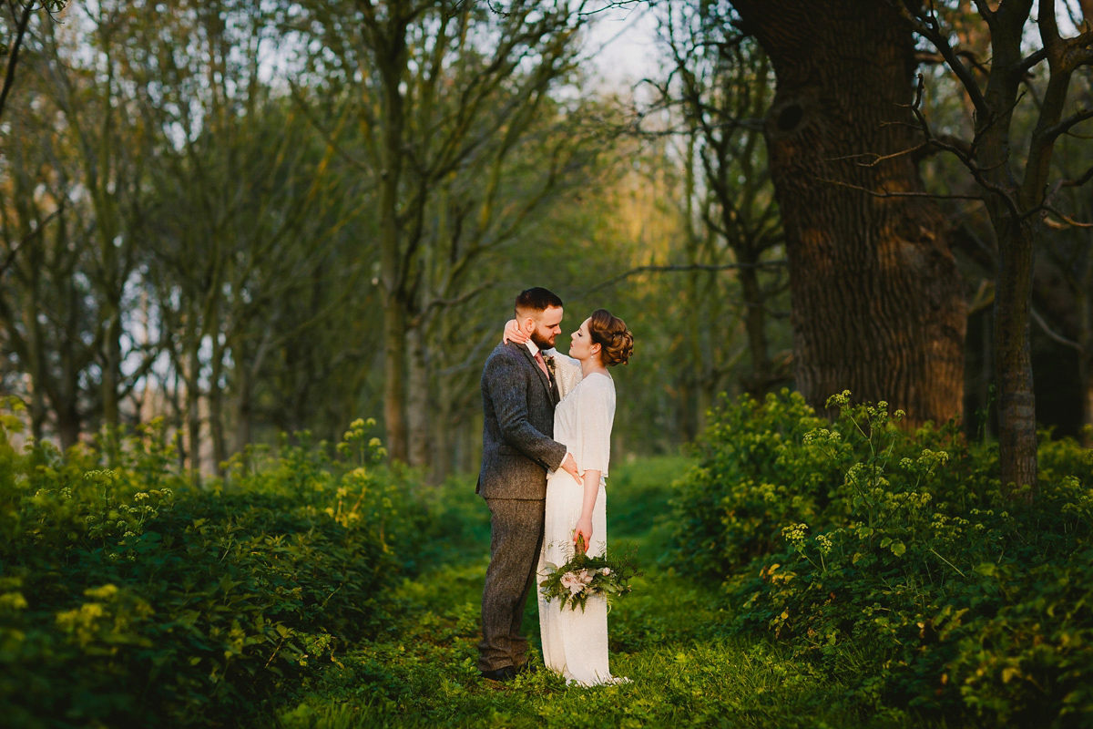 Alice wears a Downton Abbey inspired beaded gown by Eliza Jane Howell for her Suffolk countryside wedding. Photography by Andy Davison.