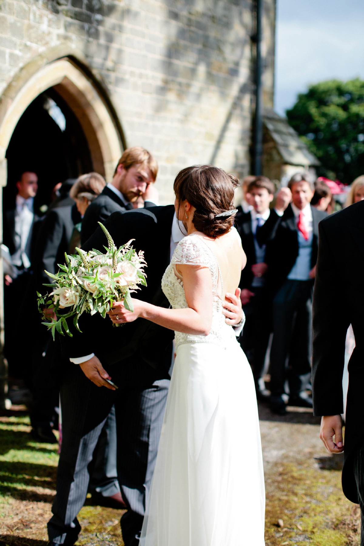 Sarah wore a Halfpenny London gown for her elegant English country garden wedding.  Photography by Helen Cawte.