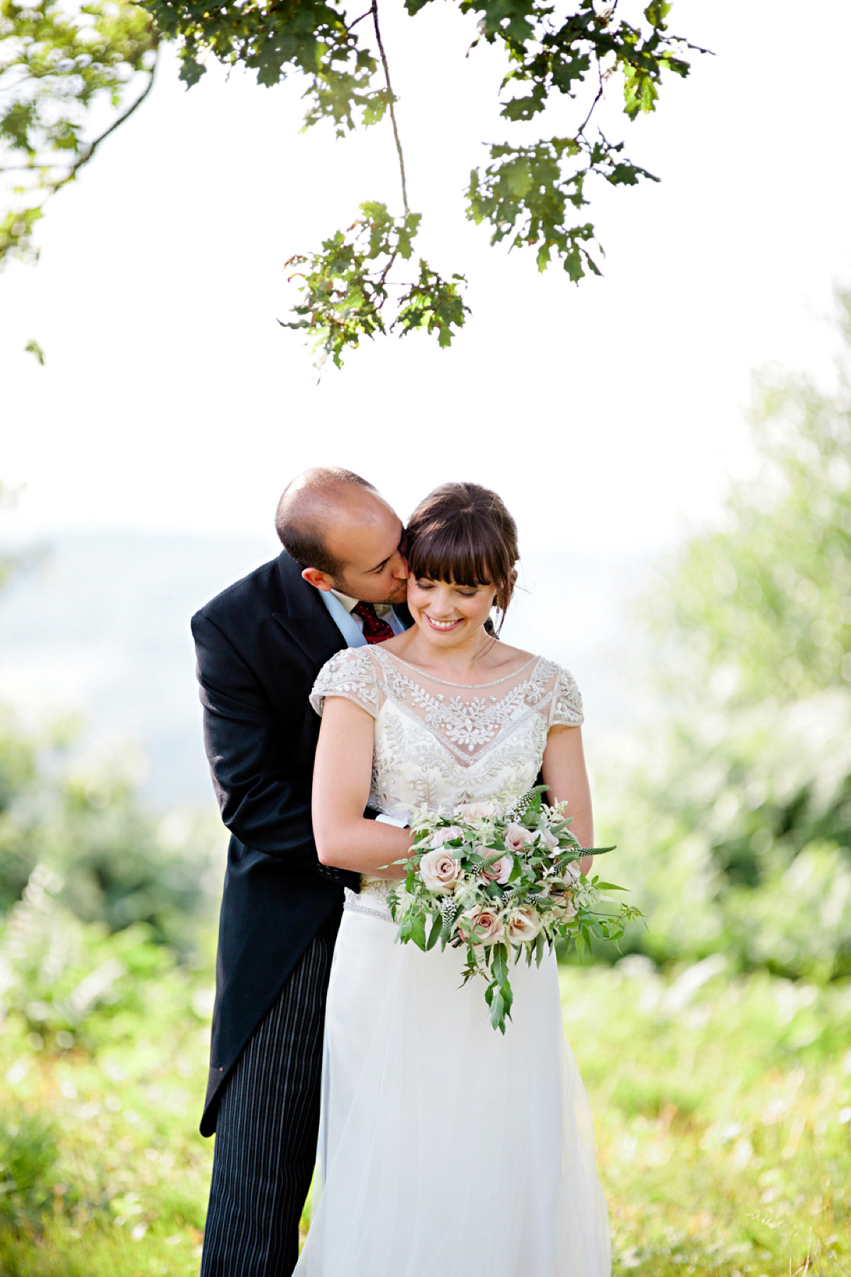 Sarah wore a Halfpenny London gown for her elegant English country garden wedding.  Photography by Helen Cawte.