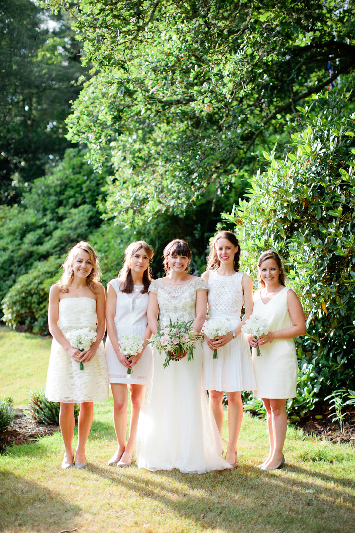 Sarah wore a Halfpenny London gown for her elegant English country garden wedding.  Photography by Helen Cawte.