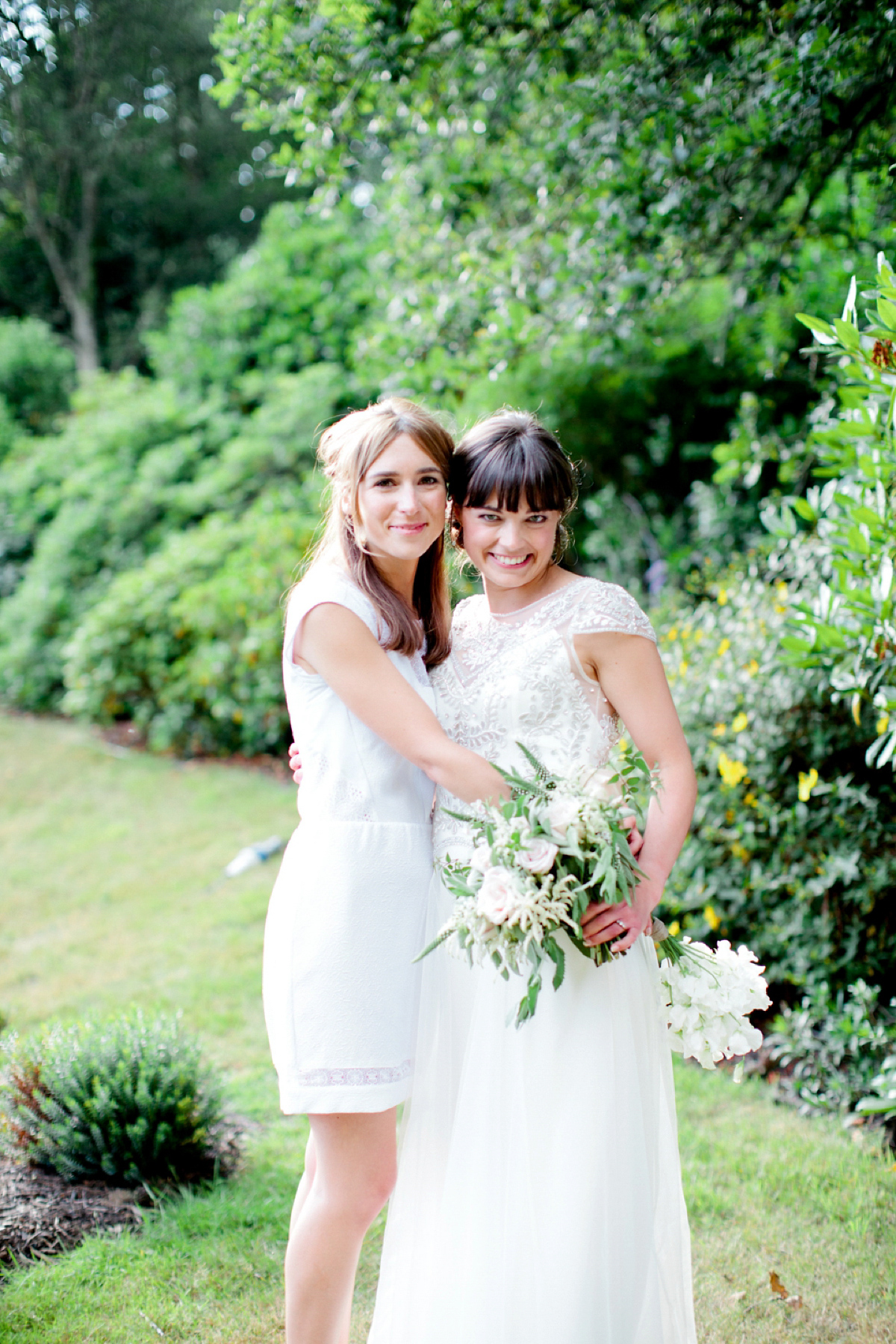 Sarah wore a Halfpenny London gown for her elegant English country garden wedding.  Photography by Helen Cawte.