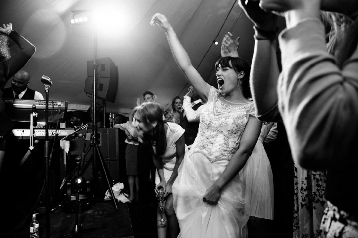 Sarah wore a Halfpenny London gown for her elegant English country garden wedding.  Photography by Helen Cawte.