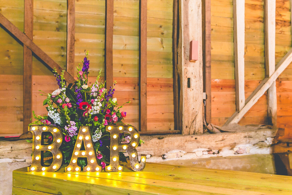 A handmade dress for a colourful and rustic, country barn wedding in the Spring. Images by ELS Photography.