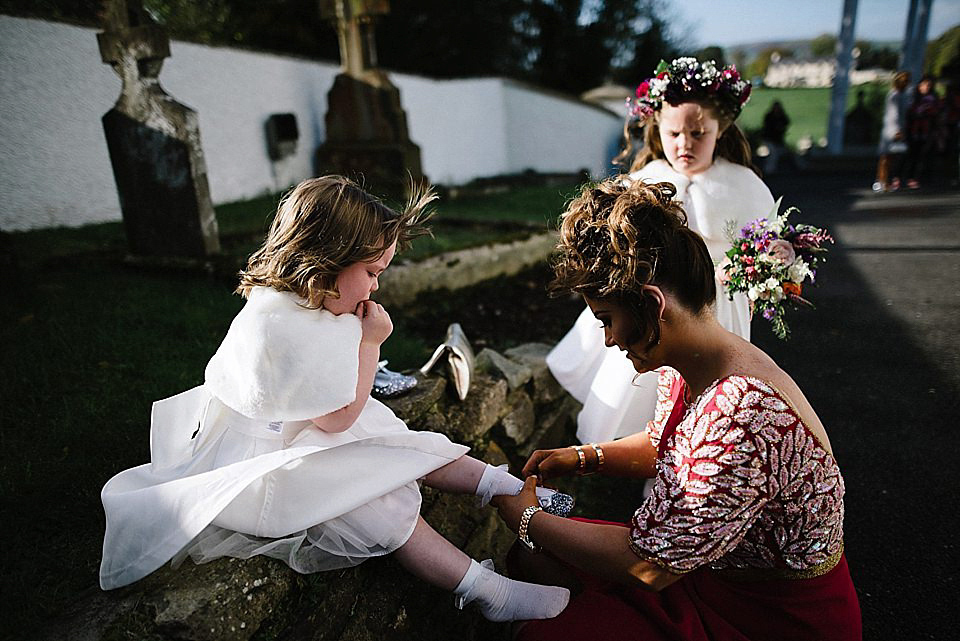 Karen wore a wedding dress with epaulettes for her Irish castle wedding in the Autumn. Photography by Epic Love.