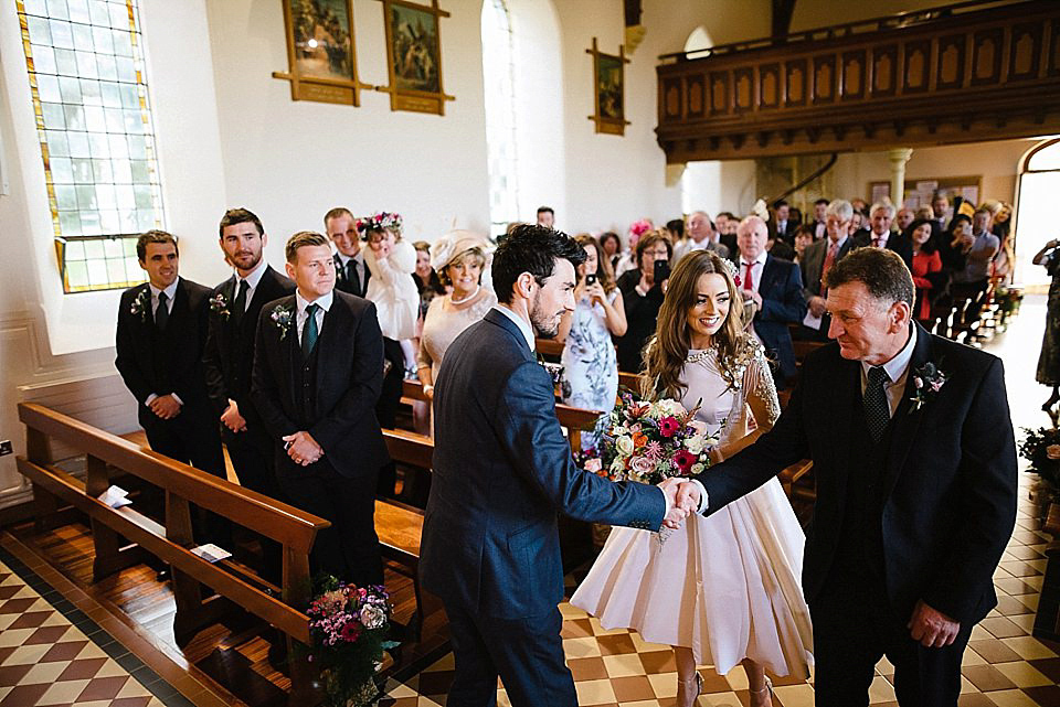 Karen wore a wedding dress with epaulettes for her Irish castle wedding in the Autumn. Photography by Epic Love.