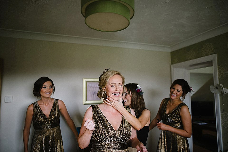 Karen wore a wedding dress with epaulettes for her Irish castle wedding in the Autumn. Photography by Epic Love.