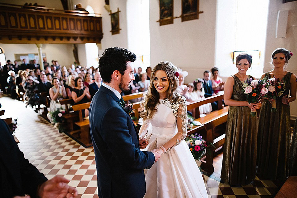 Karen wore a wedding dress with epaulettes for her Irish castle wedding in the Autumn. Photography by Epic Love.